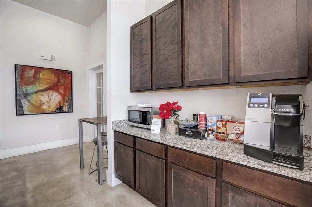 a kitchen with a counter top and a refrigerator