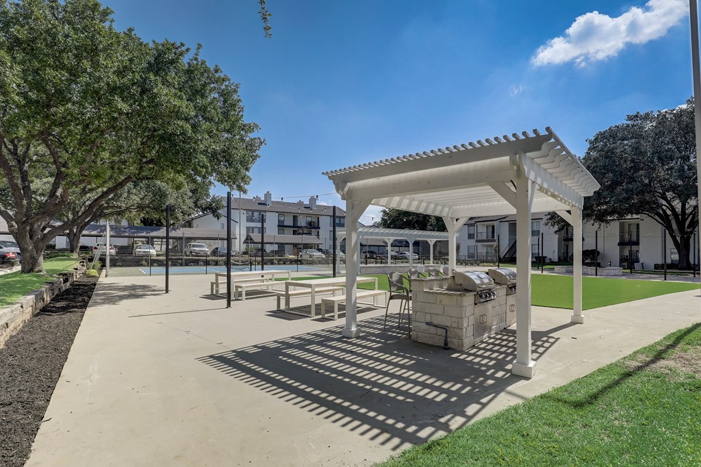 a park with a picnic area and a pavilion