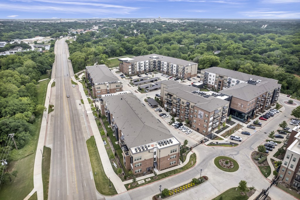 an aerial view of apartment buildings and a street