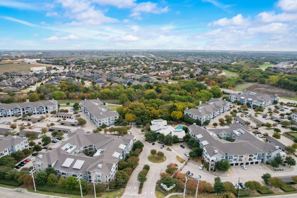 an aerial view of a neighborhood with houses and trees