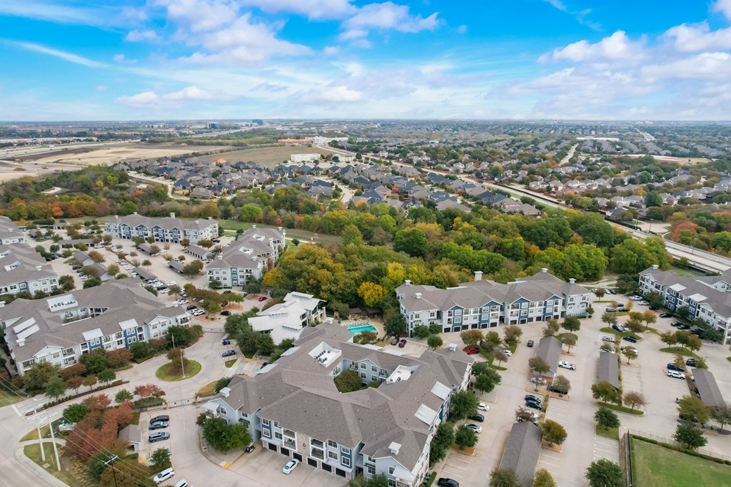 an aerial view of a neighborhood with houses and trees