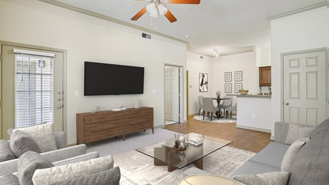 A living room with a flat screen TV mounted on the wall.