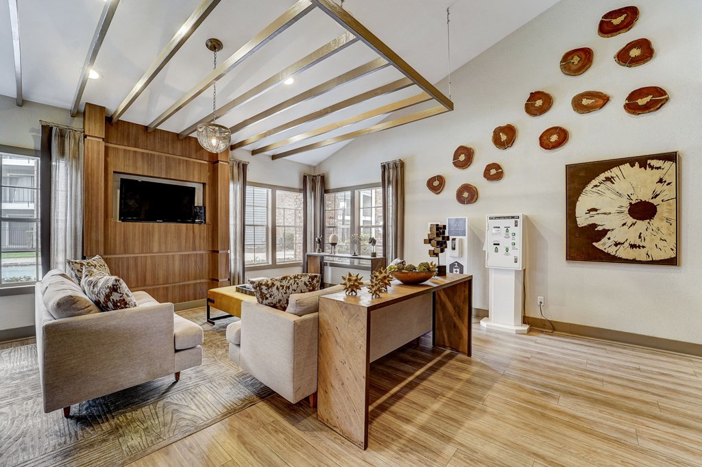 a living room with couches and a dining room table