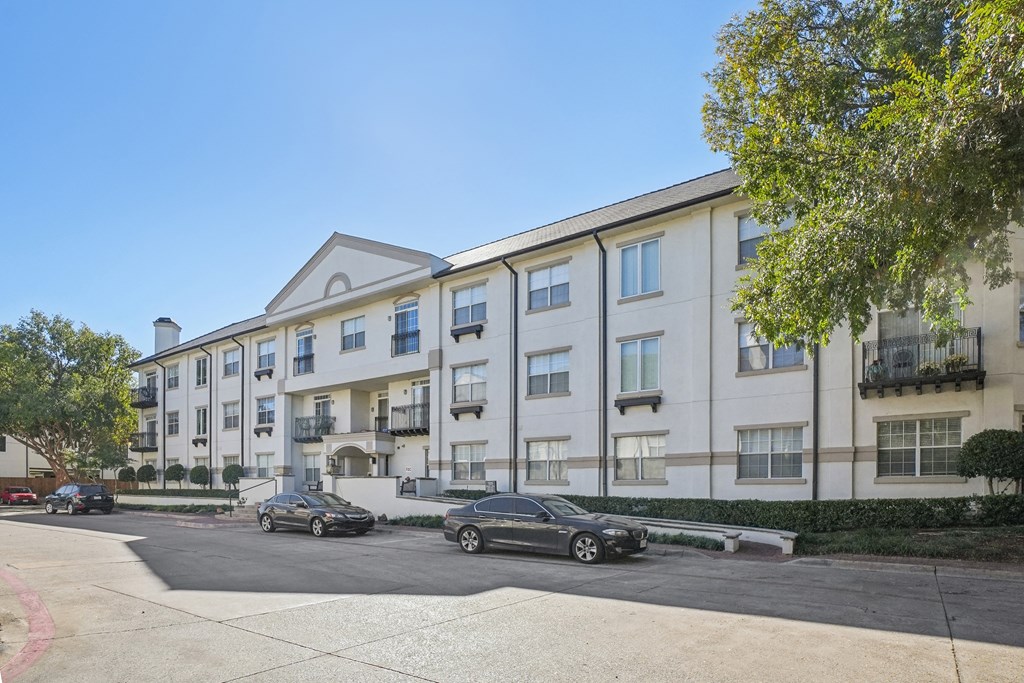 A car is parked in front of a building.