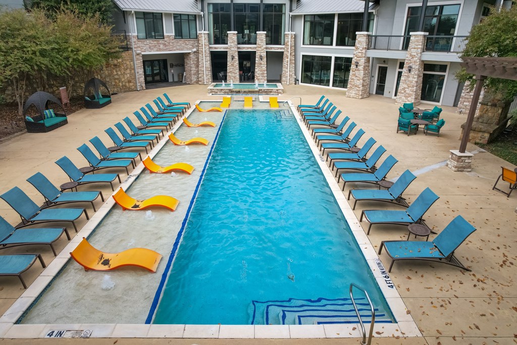 an aerial view of the pool at the resort