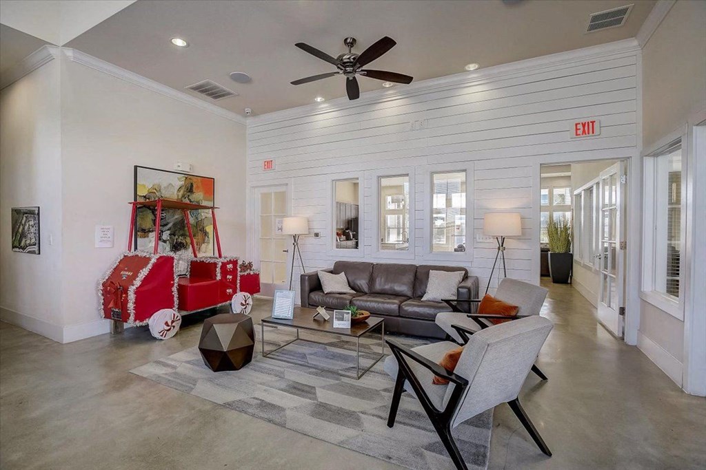 a living room with a couch and a red crib
