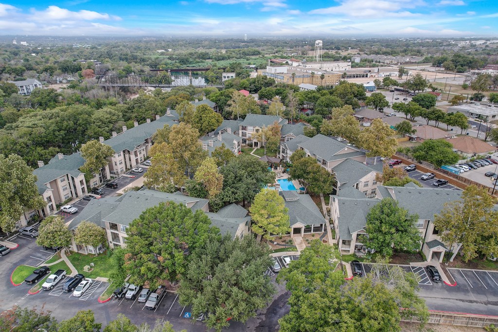an aerial view of a neighborhood with houses and trees