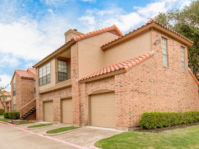a brick house with a garage door