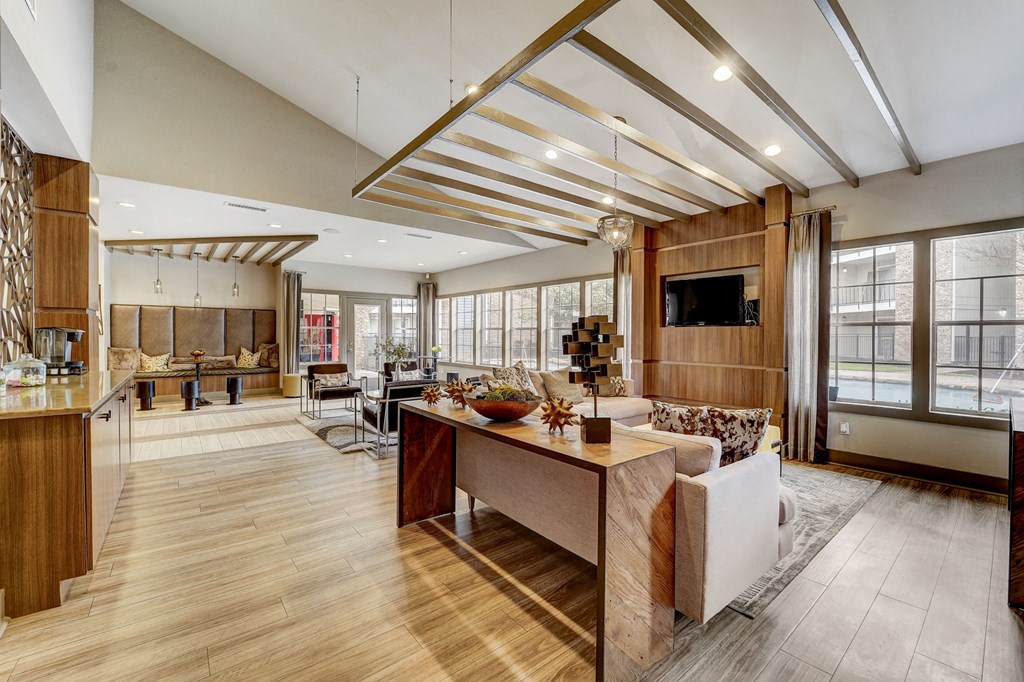 a large living room with a kitchen and a dining room