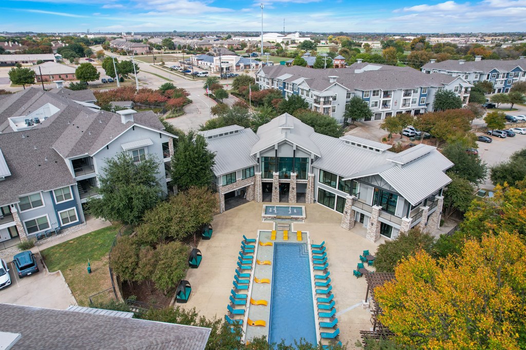 an aerial view of a house with a swimming pool
