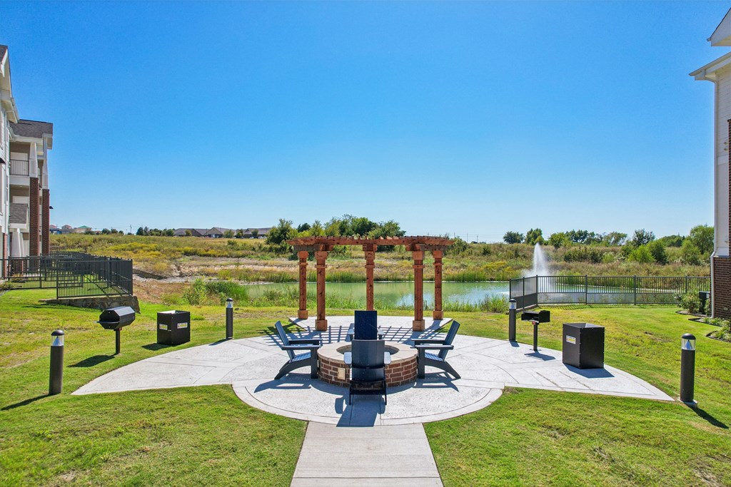A park with a fountain and a gazebo.