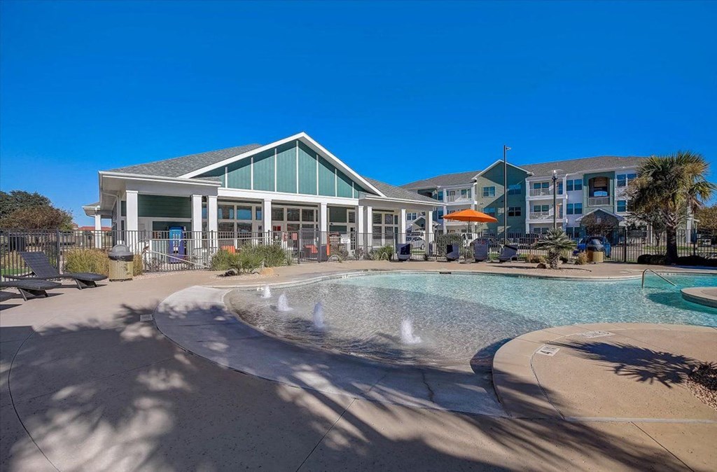 a pool with a building in the background
