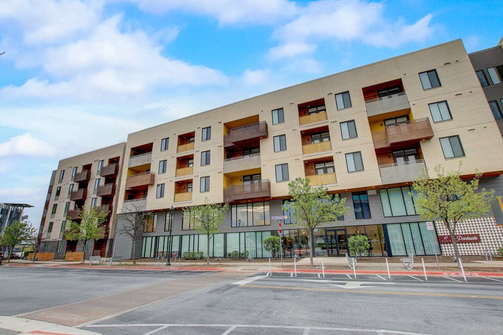 a large building with a street in front of it