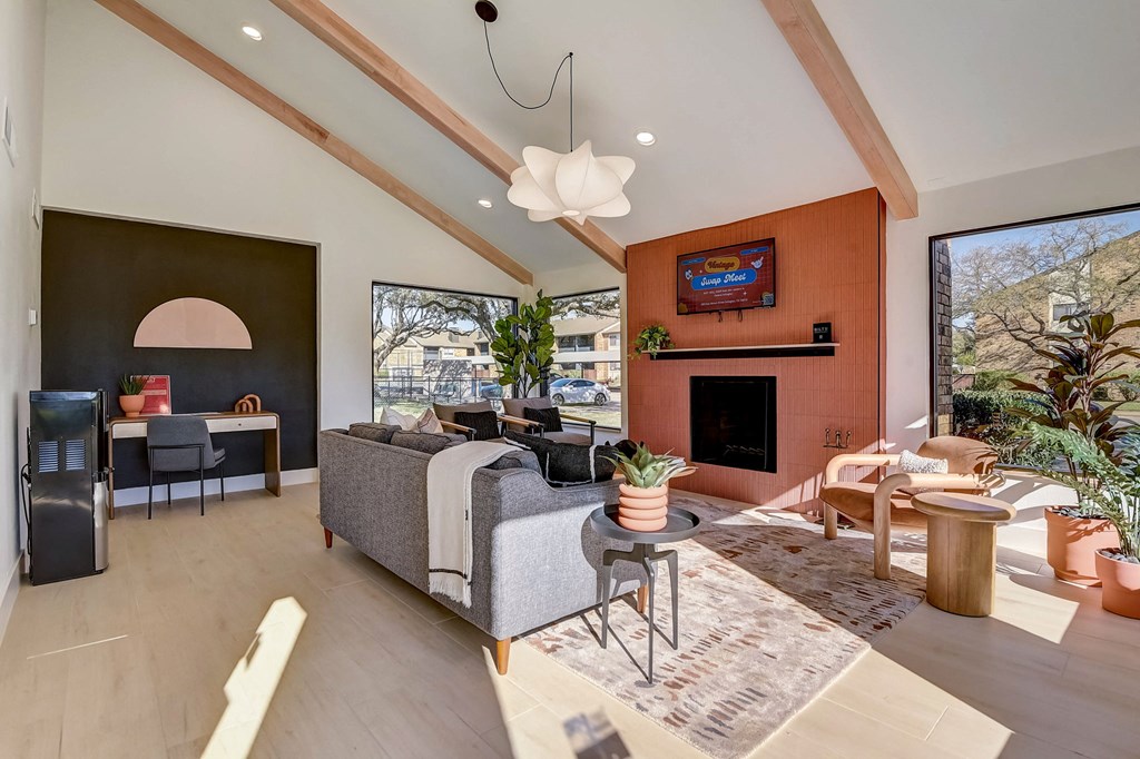 a living room with a couch and a fireplace