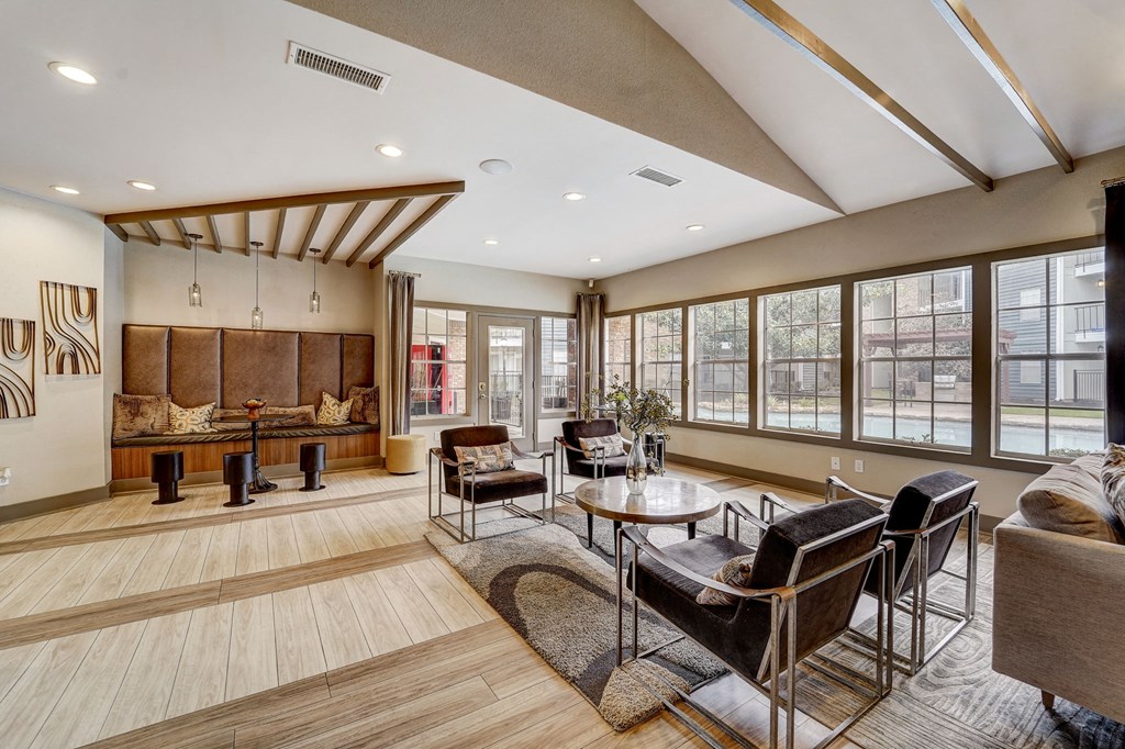 a living room with couches and chairs and a table