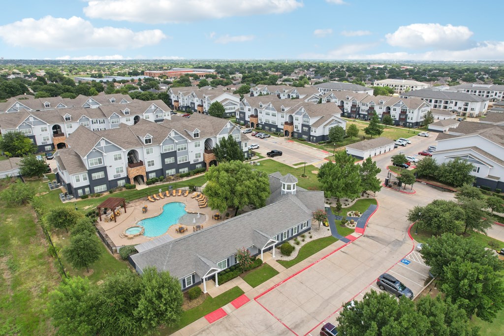 A large residential complex with a swimming pool and playground.