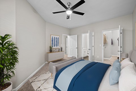 a bedroom with a large bed and a ceiling fan