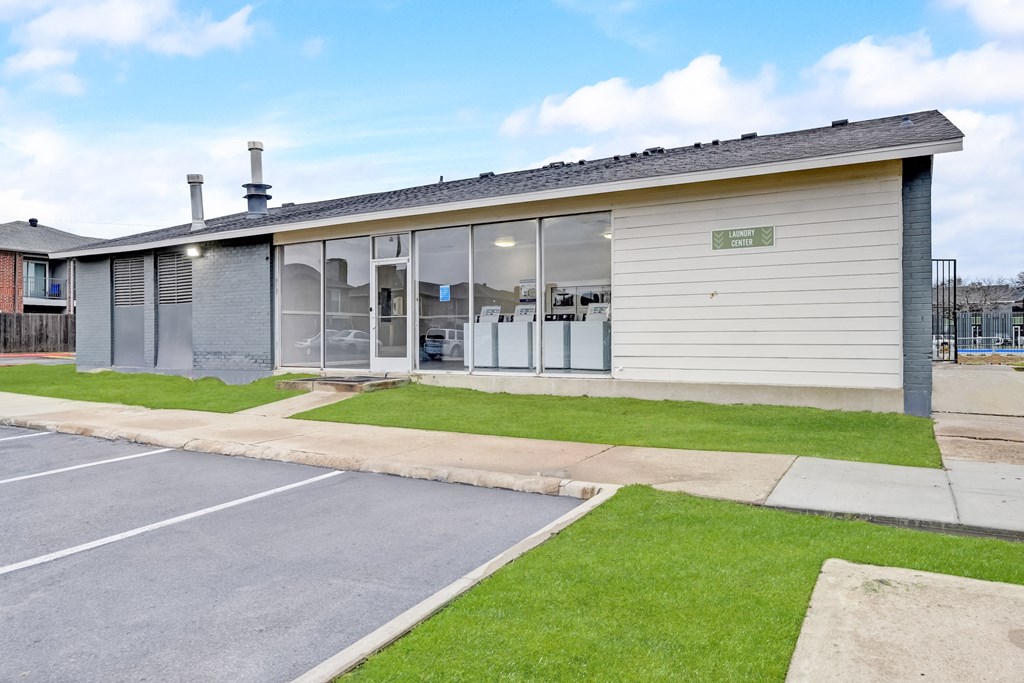 a view of the front of the building from the parking lot