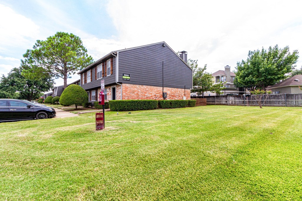 a large lawn in front of a house