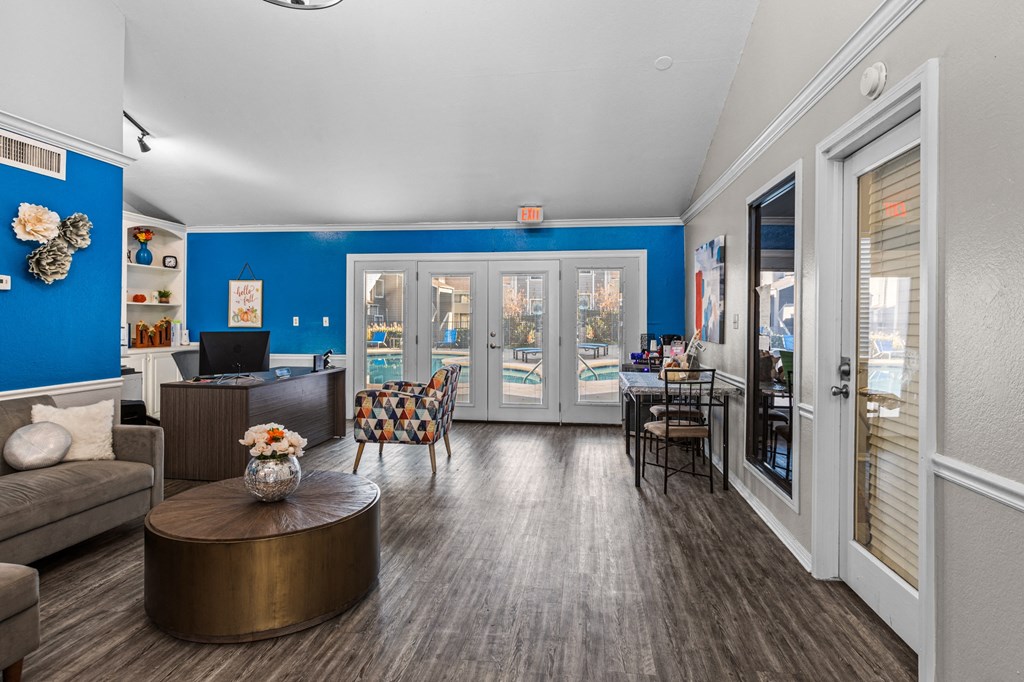 a living room with blue walls and a patio door