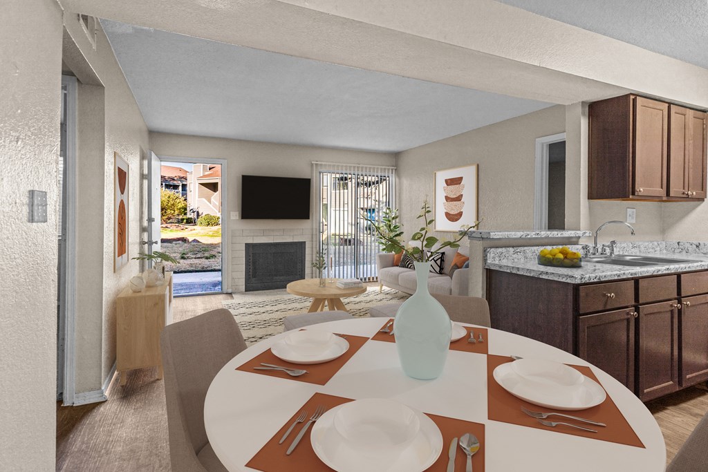 a kitchen and dining room with a table and chairs