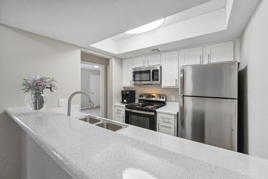the preserve at ballantyne commons apartment kitchen with stainless steel appliances