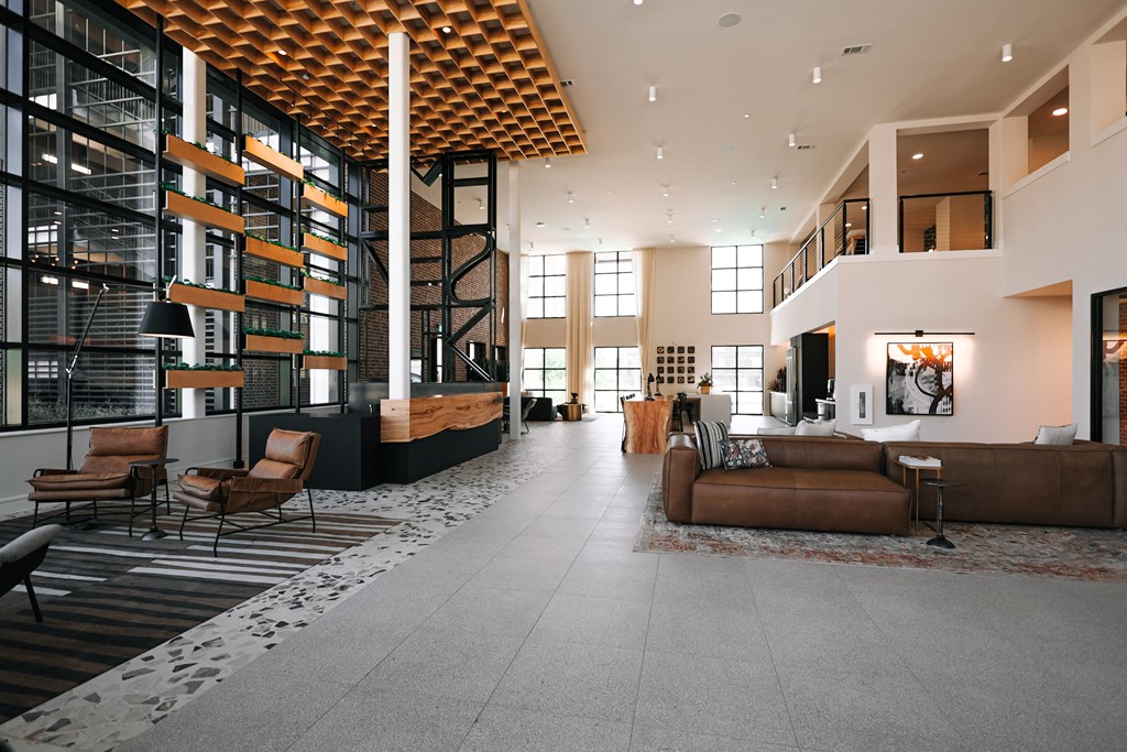 a view of the lobby of a building with couches and chairs