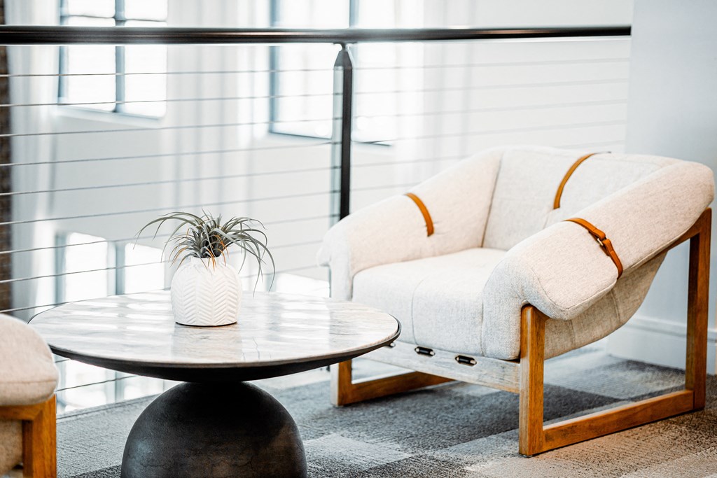 a living room with two chairs and a coffee table
