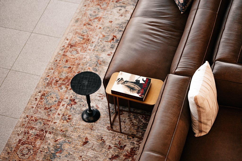a living room with a couch and a book on a table