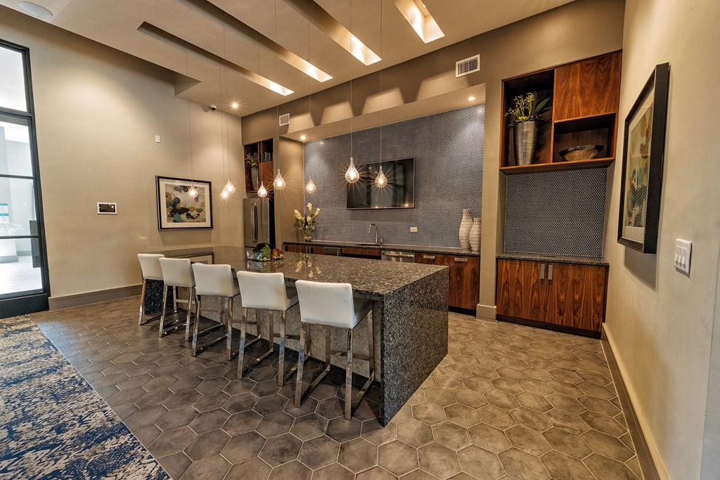 a dining room with a granite table and chairs