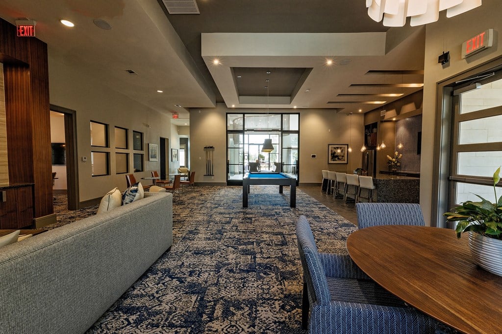 a large lobby with a ping pong table in the middle