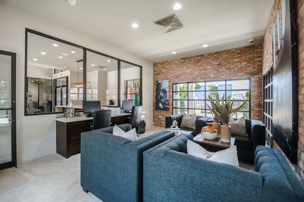 a living room filled with furniture and a large window