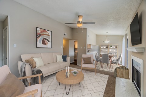 a living room and dining room with a couch and a table