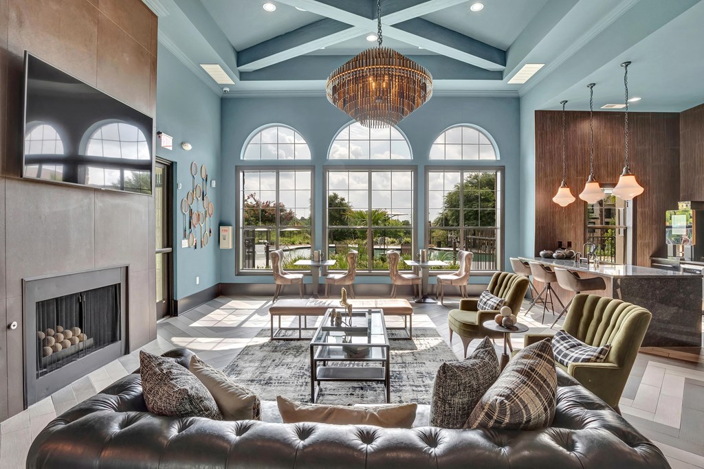 a living room filled with furniture and a large window