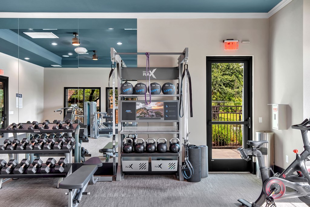 a fitness center with weights and other exercise equipment