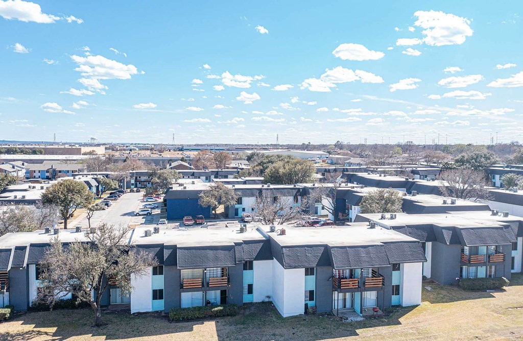 an aerial view of a group of houses in a city