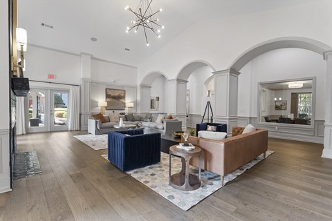 a living room with couches and a rug
