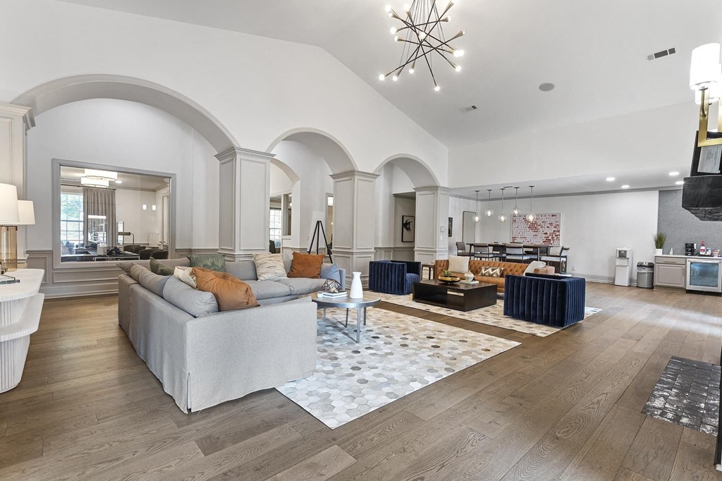 a living room with couches and a rug