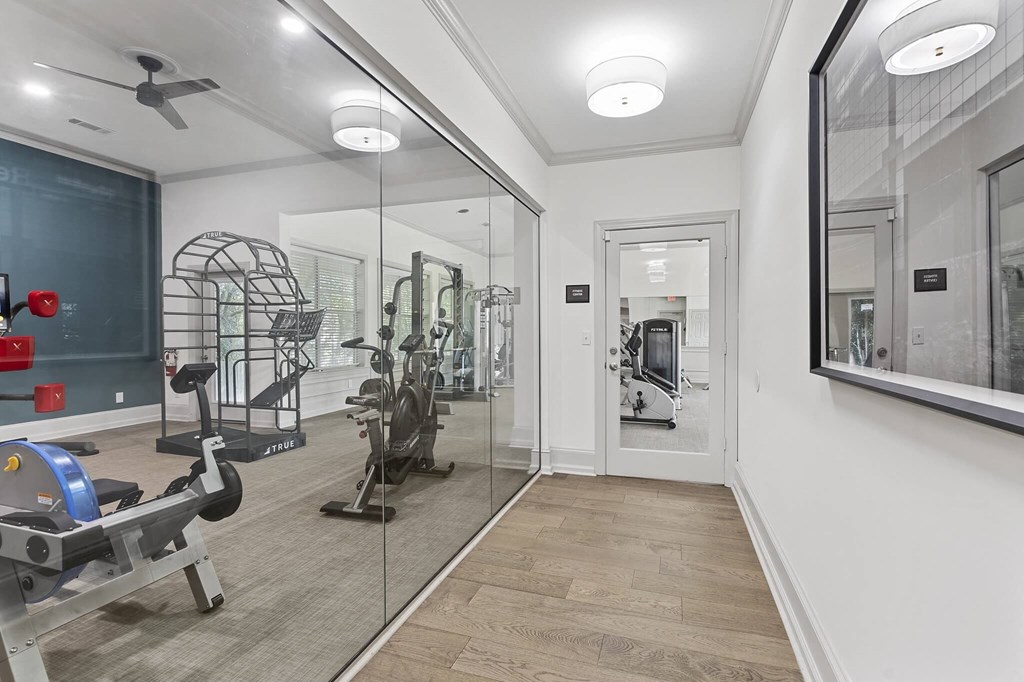 the gym in the owners home is equipped with a treadmill and weights