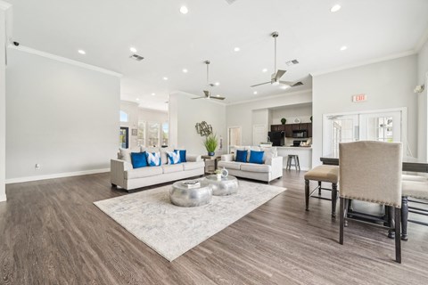 a living room with couches and chairs and a table