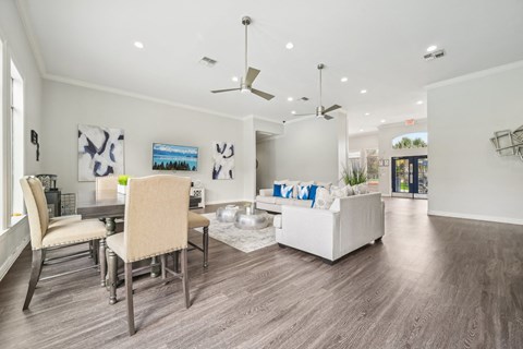 a living room and dining room with a couch and a table