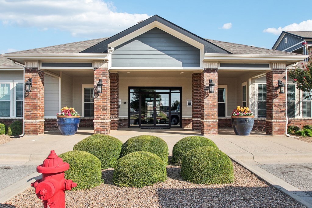 a red fire hydrant in front of a building