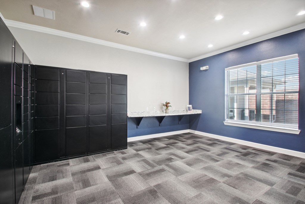 a room with a closet and a window and a wall of lockers