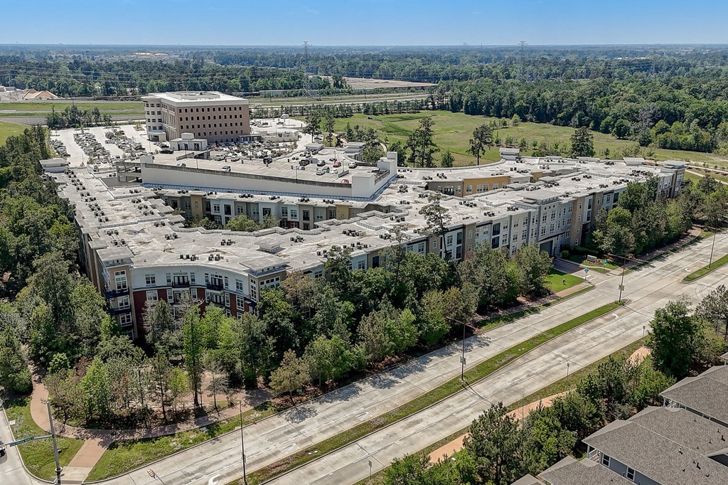 an aerial view of a city with buildings and trees