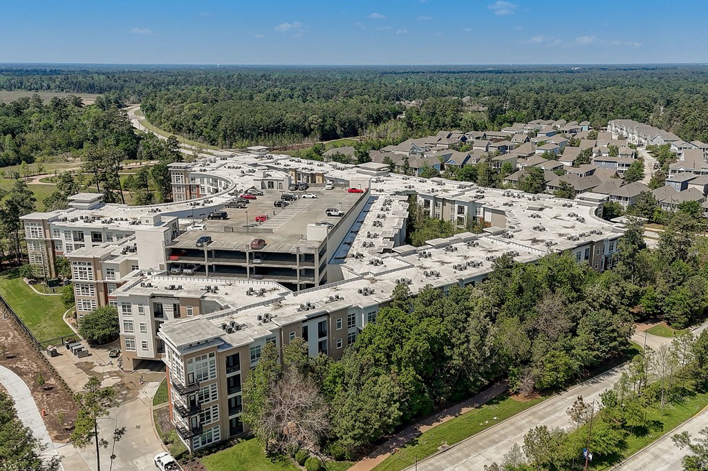 an aerial view of a city with buildings and trees