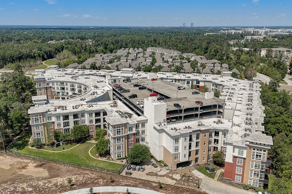 an aerial view of a city with buildings and trees