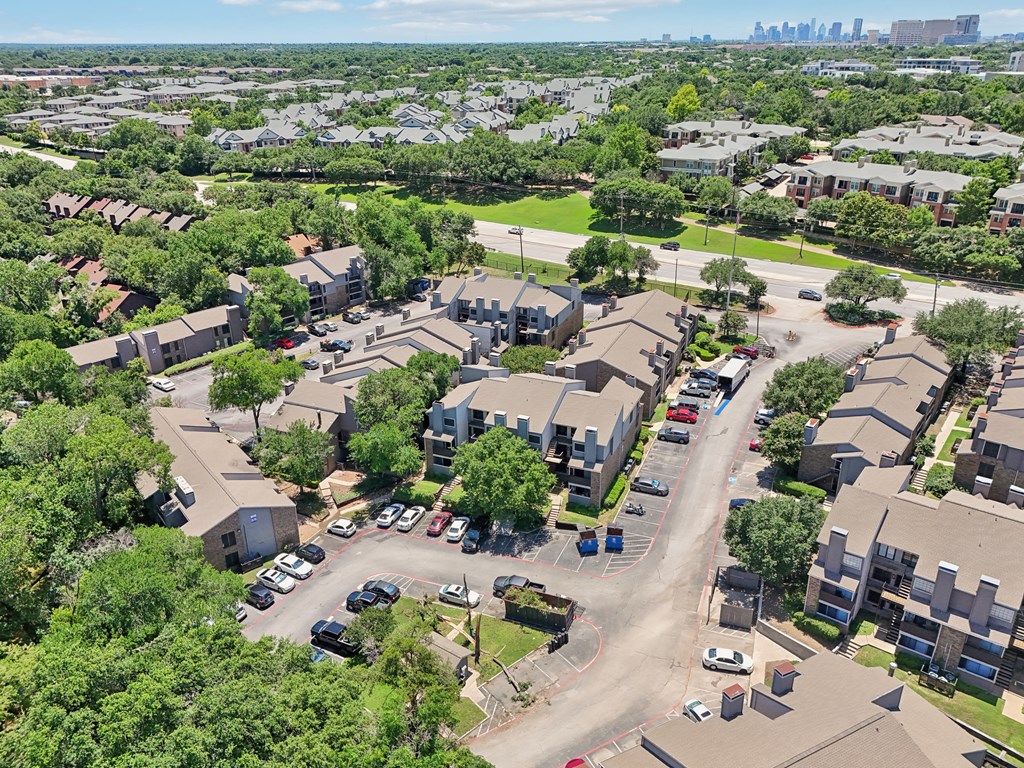 an aerial view of a neighborhood with houses and cars parked
