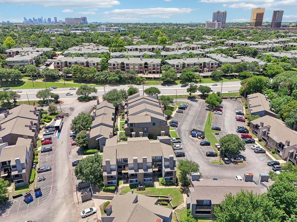 an aerial view of a neighborhood with houses and cars parked