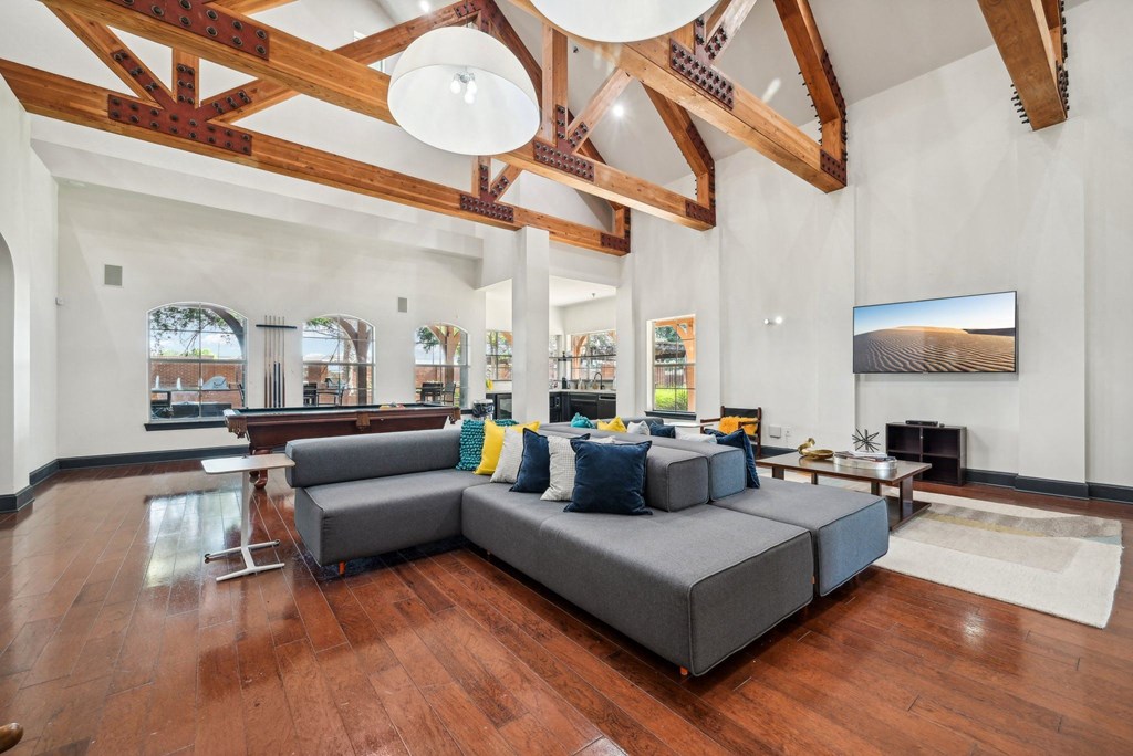 a large living room with a large couch and a table