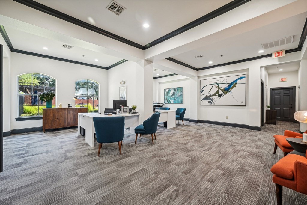 a conference room with a table and chairs in the middle